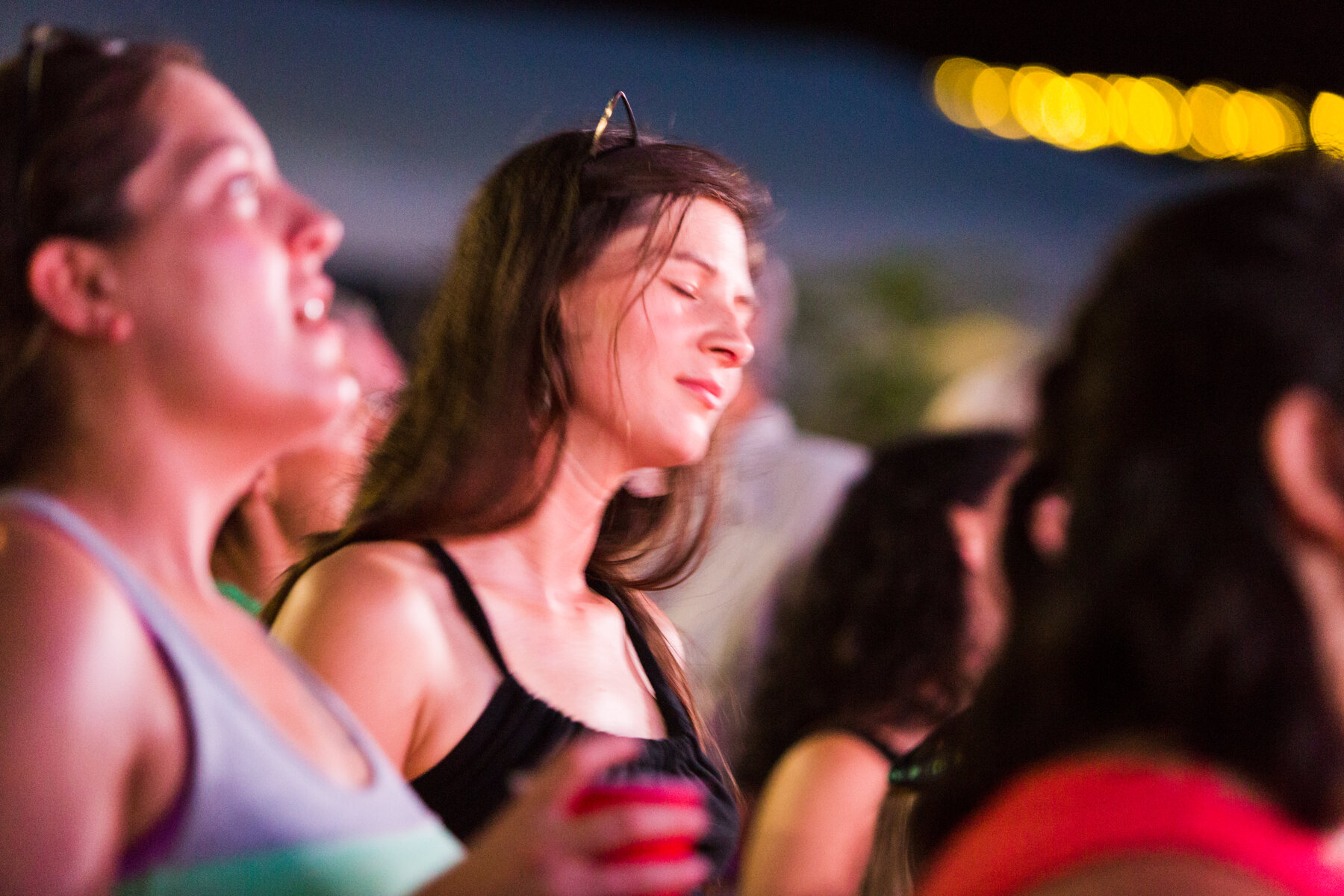 Audience members enjoying an evening performance at PaoliFest