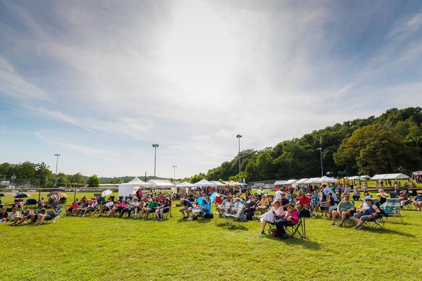 A large daytime audience gathered on the lawn at PaoliFest