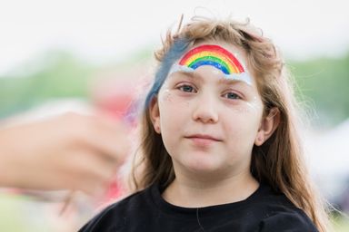 A young PaoliFest participant wearing a flower crown